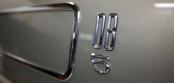DB5 Badge on a Silver Aston Martin